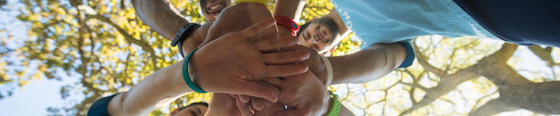 volunteers forming a hand