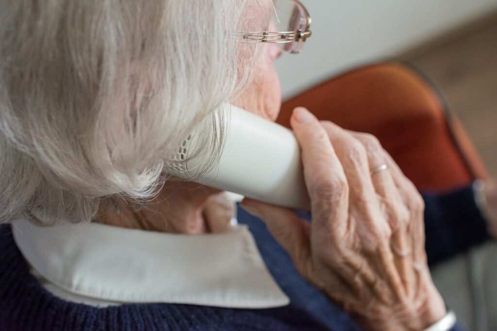 elderly woman talking on phone